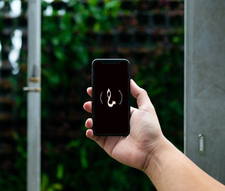 Hand holding phone mockup Street Scene